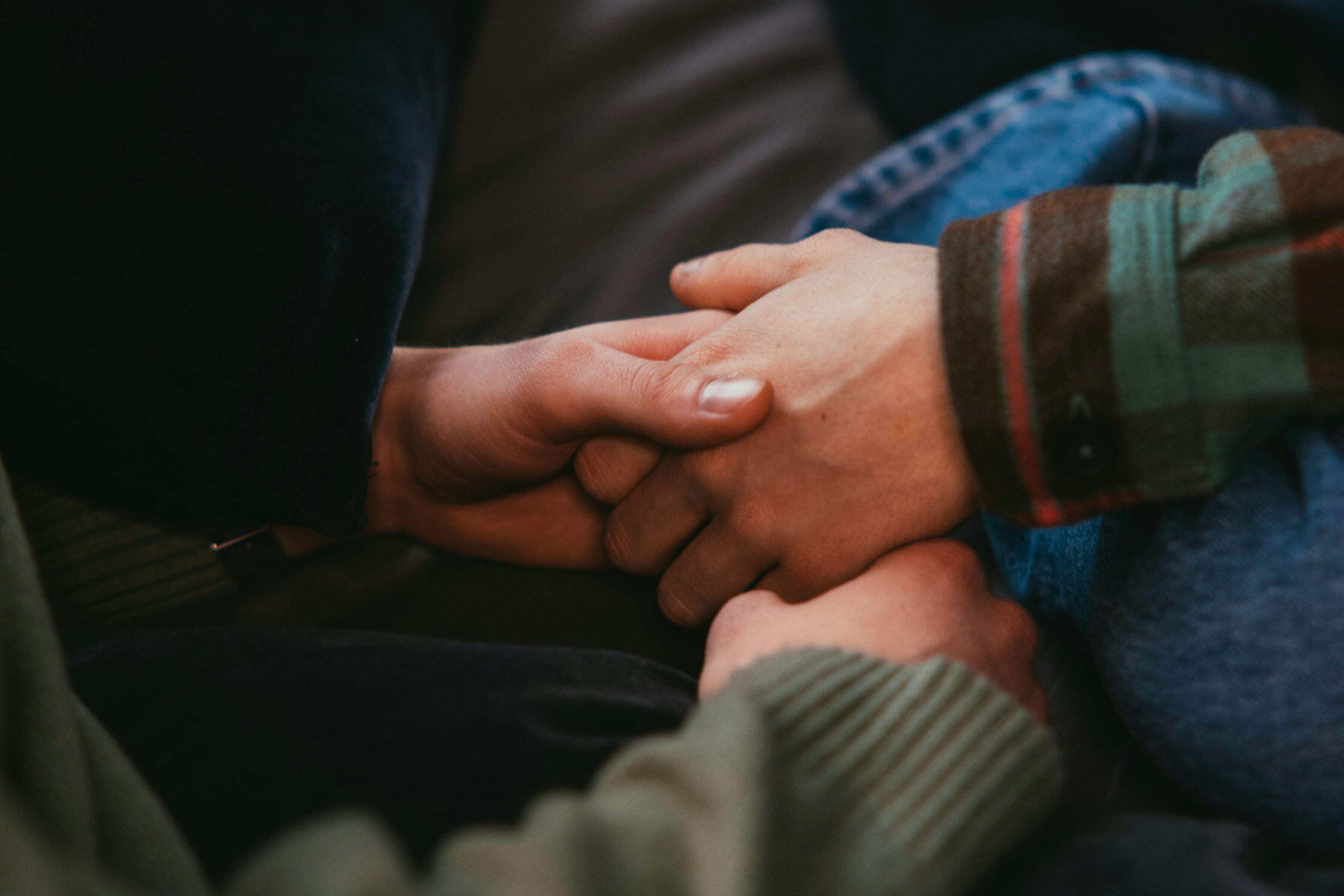 Image of someone holding hands.